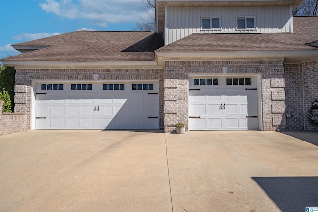 garage with concrete driveway