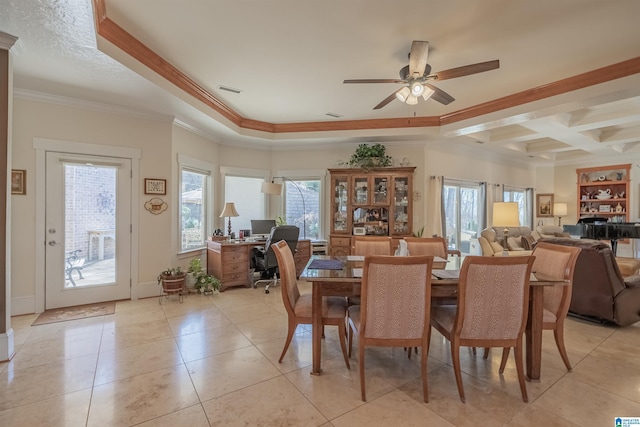 dining space with crown molding, light tile patterned floors, a healthy amount of sunlight, and ceiling fan