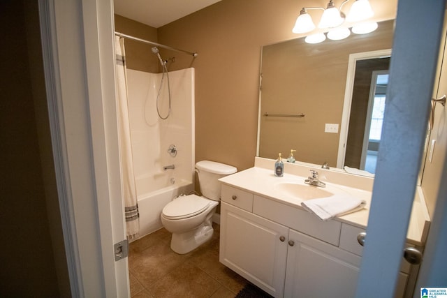 bathroom with tile patterned flooring, a notable chandelier, toilet, and vanity