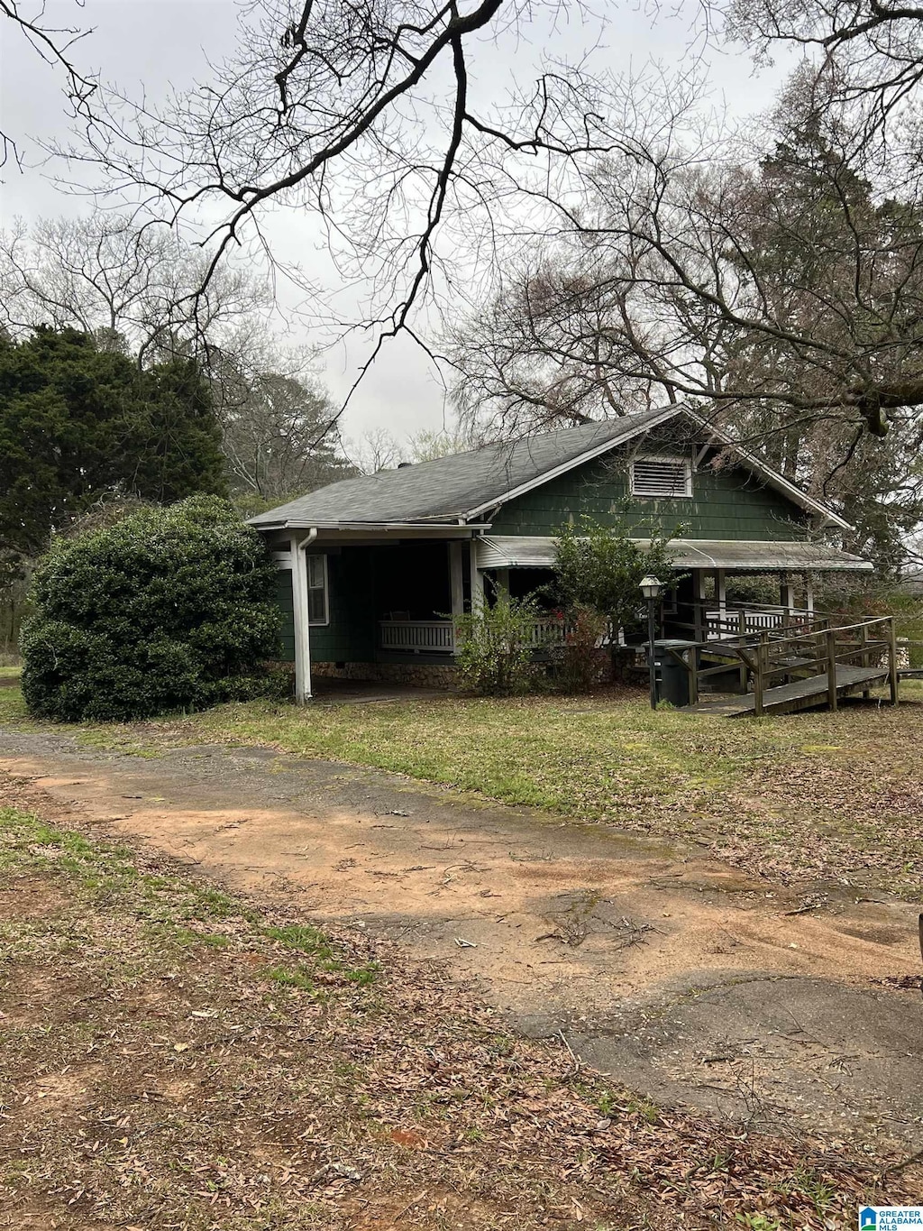 view of side of home with driveway