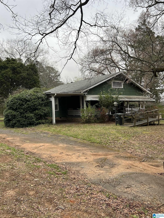 view of side of home with driveway