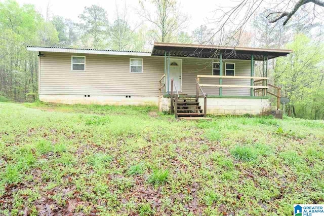 view of front of house featuring crawl space, a porch, and metal roof