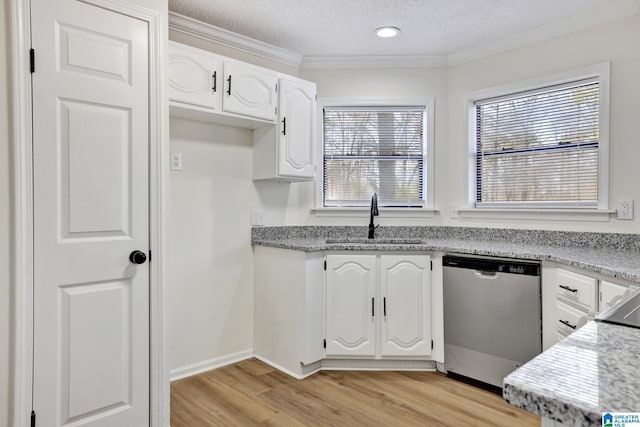 kitchen featuring stainless steel dishwasher, a textured ceiling, white cabinets, and a sink