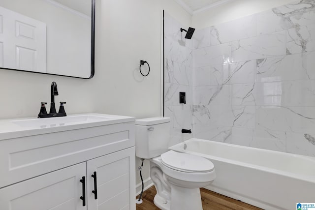 bathroom with toilet, ornamental molding, shower / bathing tub combination, wood finished floors, and vanity