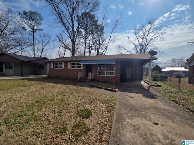 single story home with brick siding, a front lawn, fence, a carport, and driveway