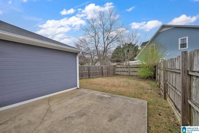 view of yard with a patio area and a fenced backyard