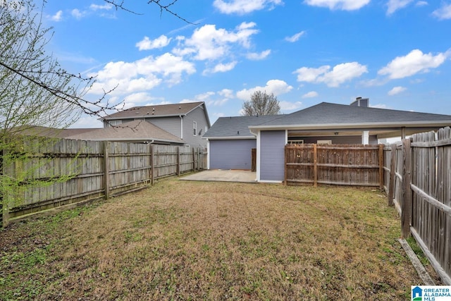 view of yard with a fenced backyard and a patio