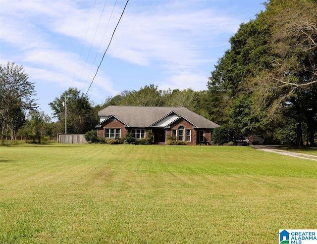 ranch-style house with a front yard