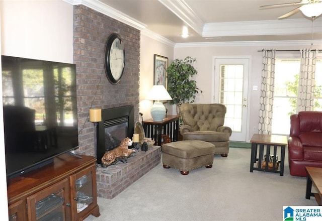 carpeted living area featuring ceiling fan, a tray ceiling, a brick fireplace, and ornamental molding