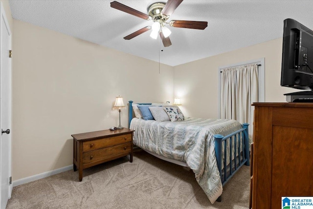 236 Oak Ridge Dr, Oneonta, AL 35121 - bedroom featuring light carpet, baseboards, ceiling fan, and a textured ceiling