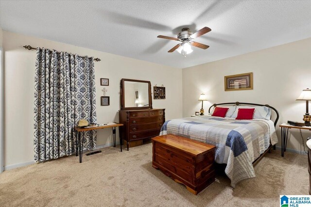 236 Oak Ridge Dr, Oneonta, AL 35121 - bedroom with baseboards, a textured ceiling, ceiling fan, and light colored carpet
