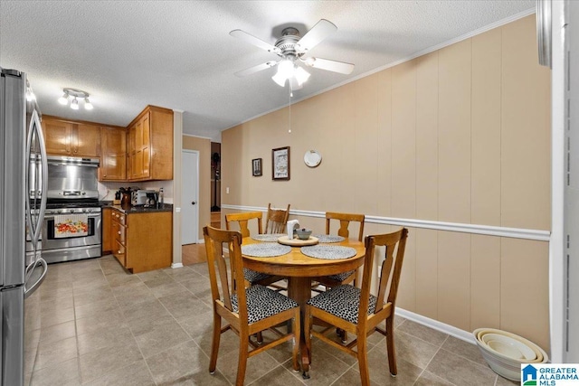 236 Oak Ridge Dr, Oneonta, AL 35121 - dining space featuring a textured ceiling, ceiling fan, and crown molding