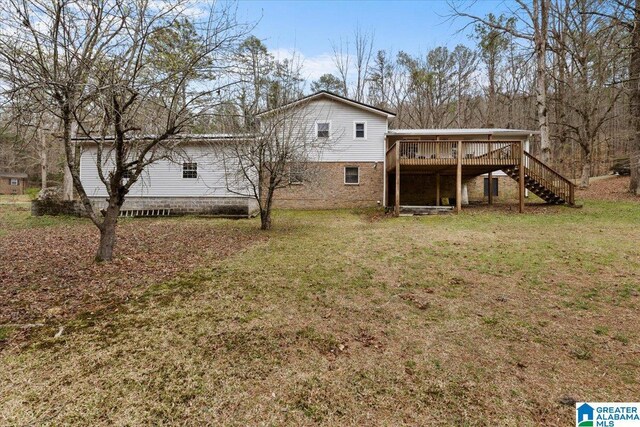 236 Oak Ridge Dr, Oneonta, AL 35121 - back of house featuring a wooden deck, stairway, and a lawn