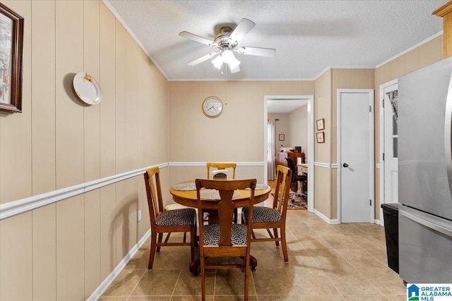 236 Oak Ridge Dr, Oneonta, AL 35121 - dining room with light tile patterned floors, ceiling fan, ornamental molding, and a textured ceiling
