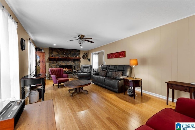 236 Oak Ridge Dr, Oneonta, AL 35121 - living room featuring a ceiling fan, baseboards, a fireplace, and wood finished floors