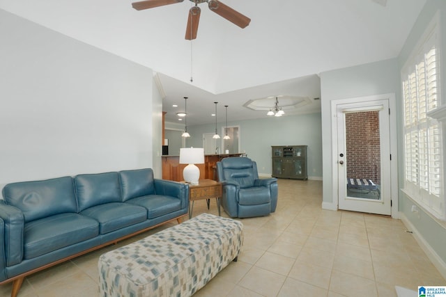 living area featuring light tile patterned flooring, a healthy amount of sunlight, and ceiling fan