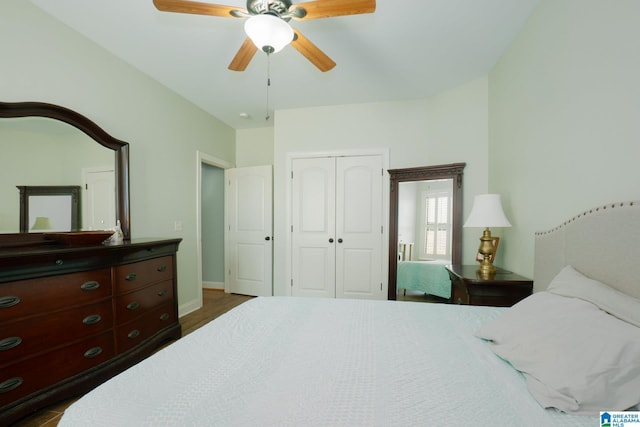 bedroom with a closet, baseboards, and ceiling fan