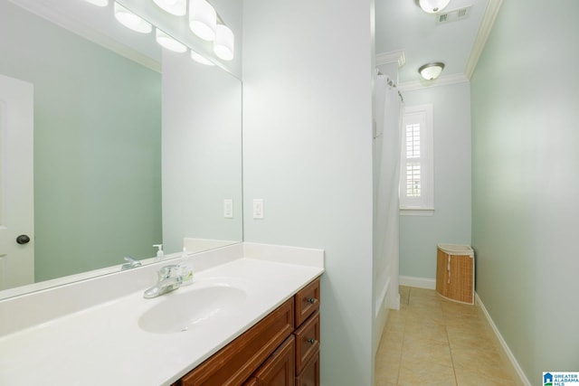 bathroom featuring visible vents, crown molding, tile patterned flooring, baseboards, and vanity