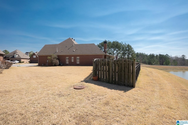 exterior space featuring a yard and fence