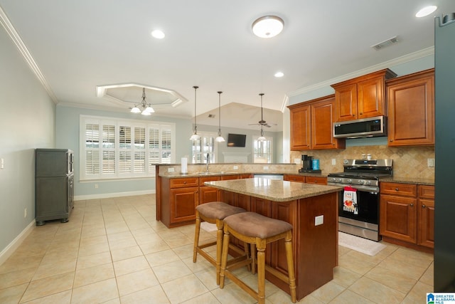 kitchen with visible vents, backsplash, stainless steel appliances, a peninsula, and crown molding