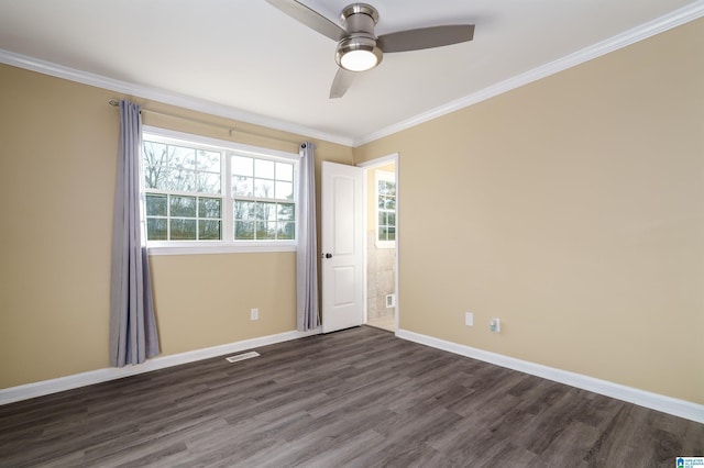 empty room with baseboards, dark wood-style floors, a ceiling fan, and crown molding