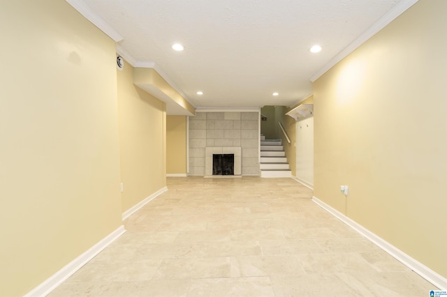 unfurnished living room featuring recessed lighting, a fireplace, baseboards, and ornamental molding