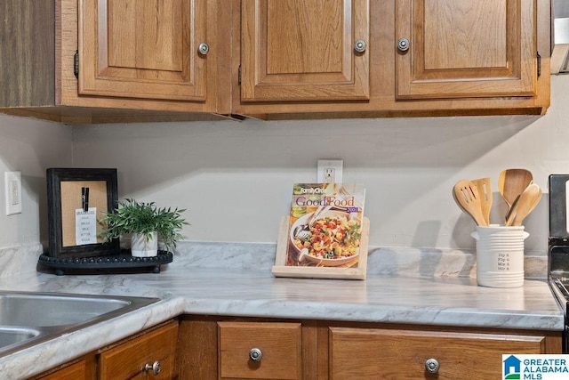 details with light countertops and brown cabinetry