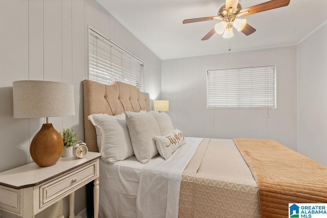 bedroom with crown molding and ceiling fan