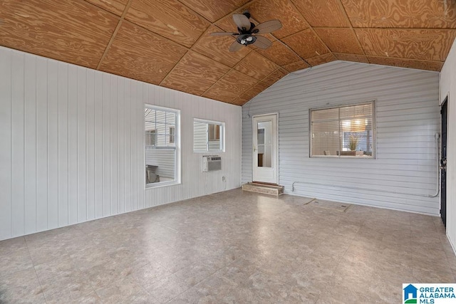 exterior space featuring a ceiling fan and a wall mounted air conditioner