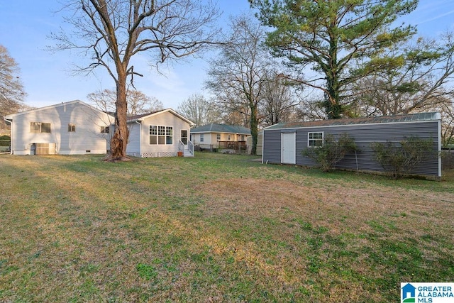 view of yard featuring an outbuilding and a storage shed