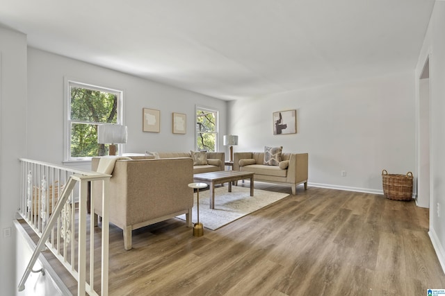 living area featuring wood finished floors and baseboards