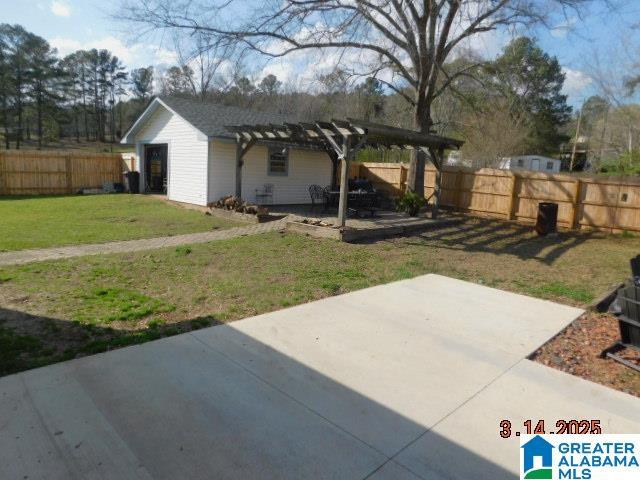 view of yard with a patio area, a pergola, and fence private yard