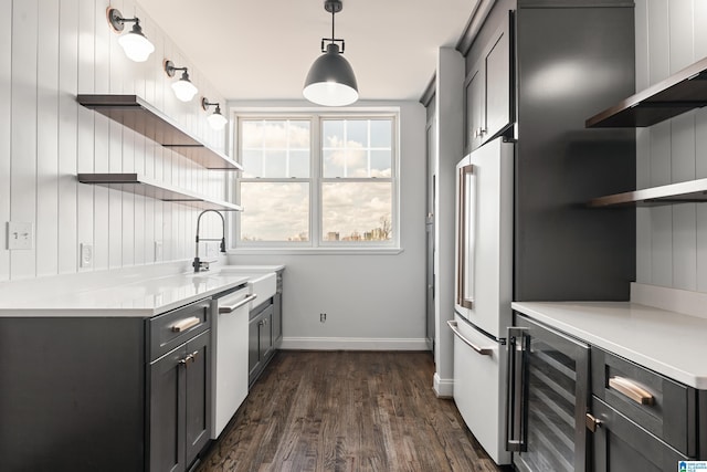 kitchen featuring wine cooler, a sink, white appliances, and open shelves