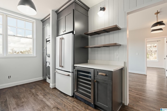 kitchen featuring open shelves, wine cooler, high end white refrigerator, light countertops, and dark wood-style flooring