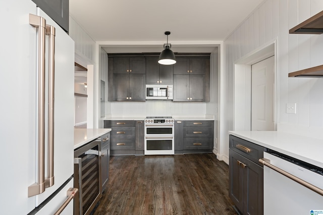 kitchen with beverage cooler, dark wood finished floors, light countertops, white appliances, and open shelves