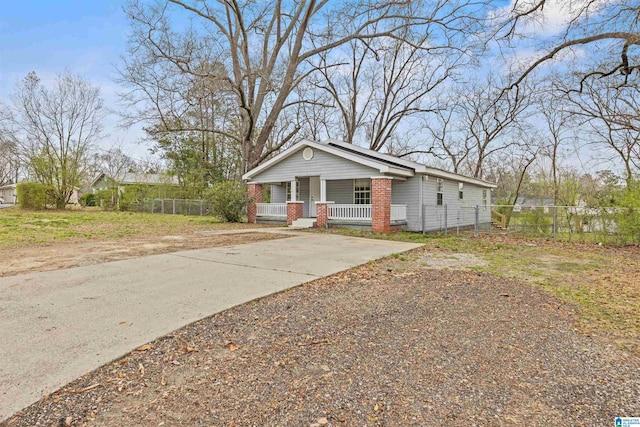 view of front of property featuring a porch and fence