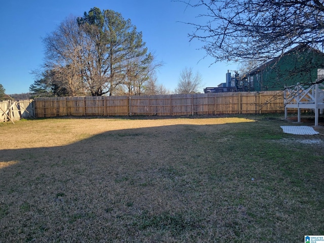 view of yard featuring a fenced backyard