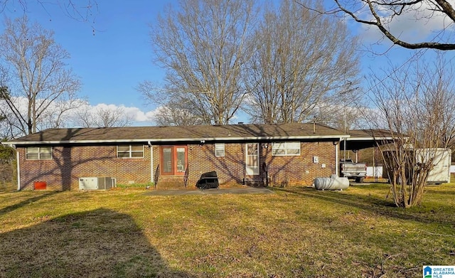 282 Stewart Rd, Cullman, AL 35055 - back of house featuring brick siding, a lawn, and entry steps