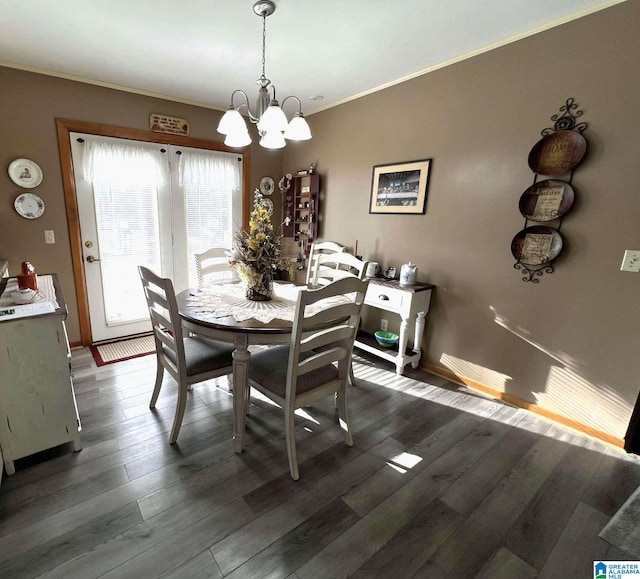 282 Stewart Rd, Cullman, AL 35055 - dining area featuring baseboards, dark wood-type flooring, an inviting chandelier, and crown molding