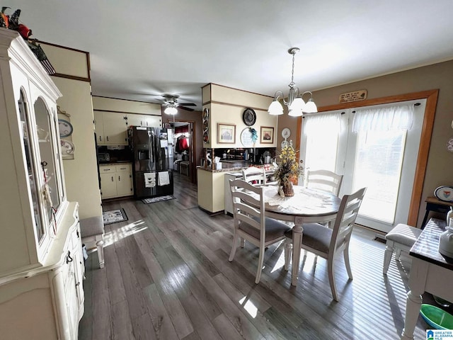 282 Stewart Rd, Cullman, AL 35055 - dining room with dark wood-type flooring and ceiling fan with notable chandelier