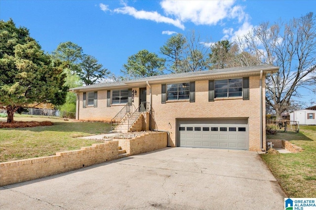 view of front of property featuring an attached garage, a front lawn, fence, stucco siding, and driveway