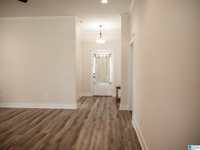 entrance foyer featuring dark wood-type flooring, recessed lighting, crown molding, and baseboards