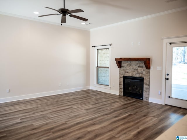 unfurnished living room featuring dark wood-style floors, baseboards, ceiling fan, and crown molding