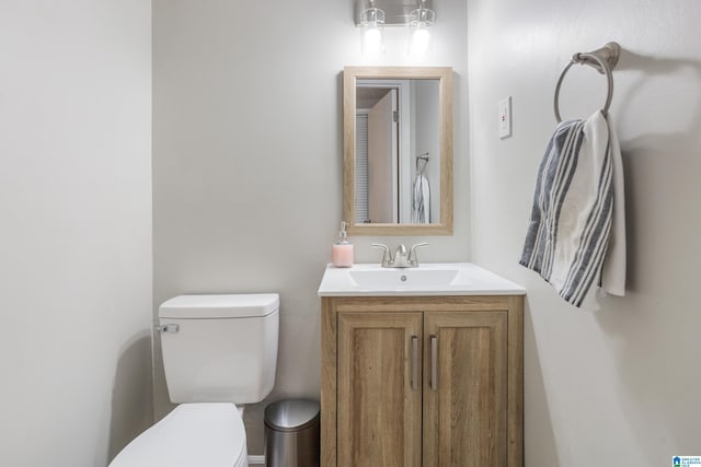 bathroom with toilet and vanity