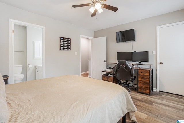 bedroom featuring connected bathroom, baseboards, ceiling fan, and light wood finished floors