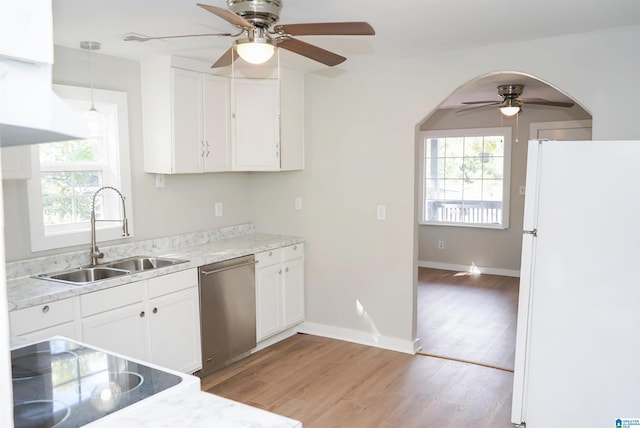 3459 35th Ave N, Birmingham, AL 35207 - kitchen featuring ceiling fan, light wood-style flooring, stainless steel dishwasher, freestanding refrigerator, and a sink