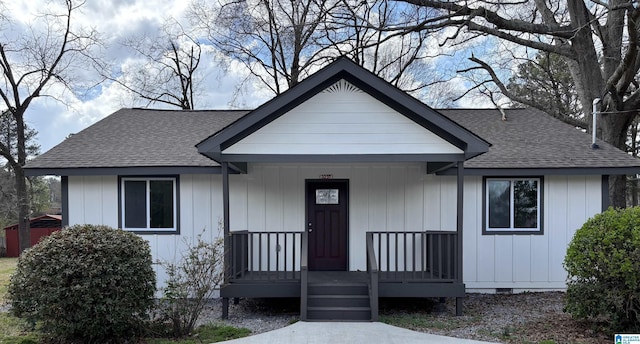 view of front of house featuring covered porch, roof with shingles, and crawl space