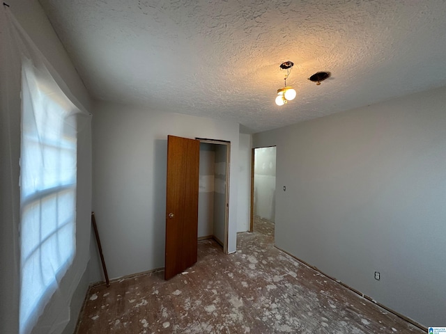 861 Lankford Ln, Alexandria, AL 36250 - unfurnished bedroom featuring a closet and a textured ceiling