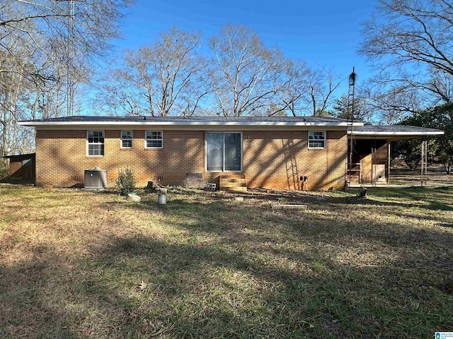 861 Lankford Ln, Alexandria, AL 36250 - back of house with an attached carport, a lawn, and brick siding