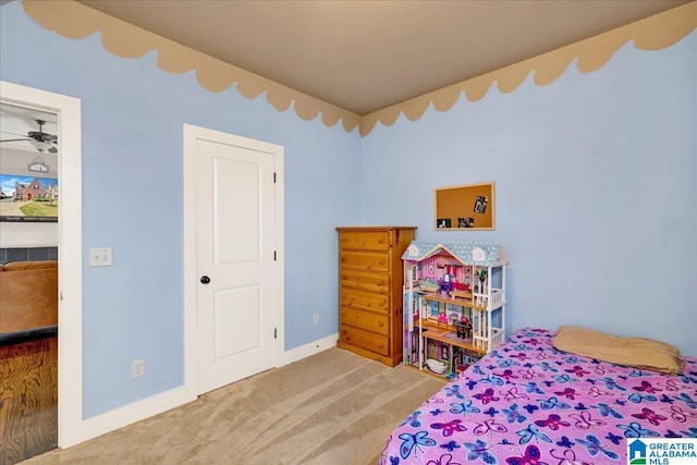 bedroom featuring baseboards and carpet